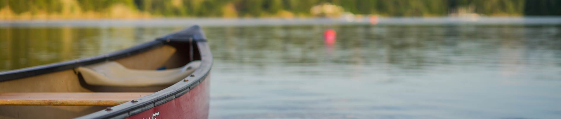 A canoe floats on a lake.