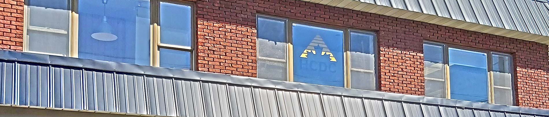 Photo of the Haliburton County Development Corp building with HCDC logo in the window.