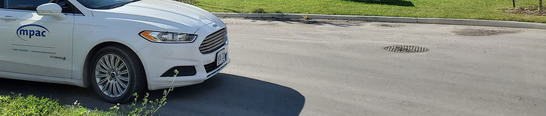 A vehicle with the MPAC logo parked on the street.