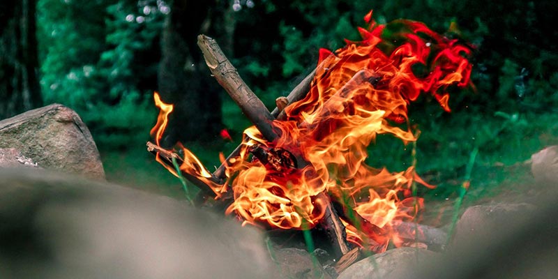 Close up photo of the flames from a small campfire.