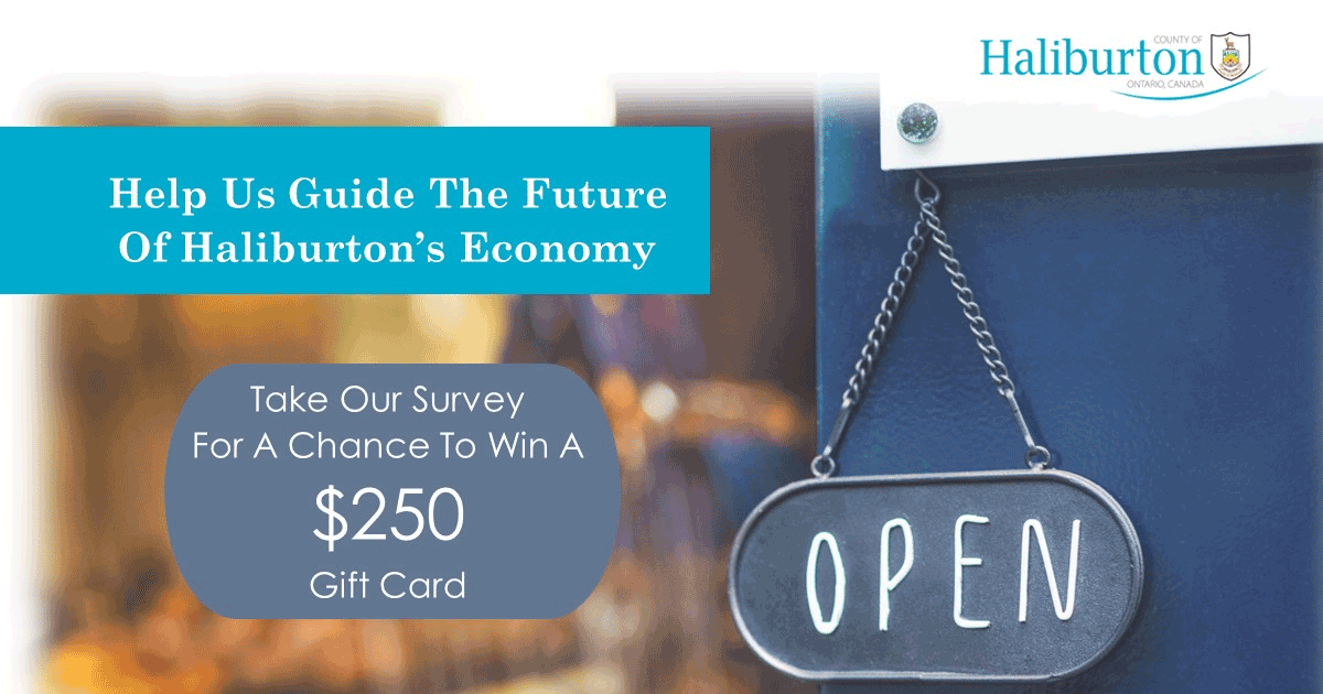 Open sign hanging on a door that says Haliburton County