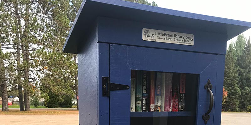 The blue box in Cardiff with glass door and books inside.