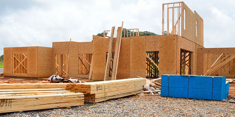 Supplies stacked up outside a new home build.