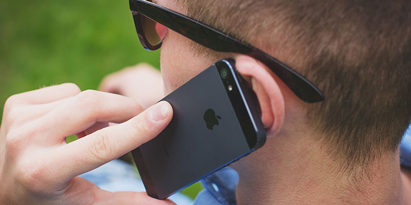 Man holding a cellphone to his ear.