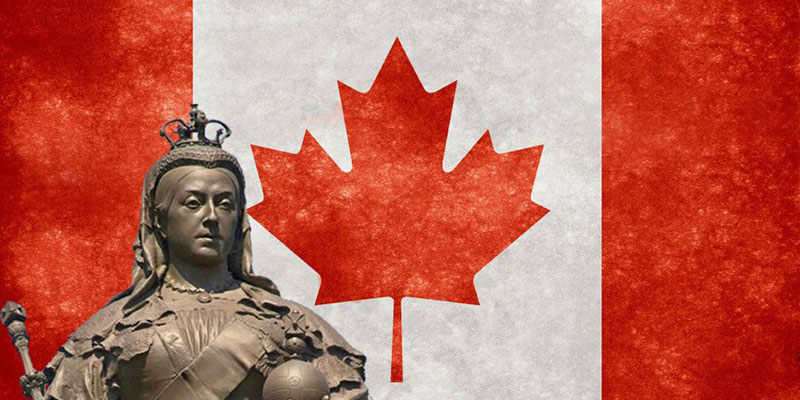 A bust of Queen Victoria stands in front of the Canadian flag.